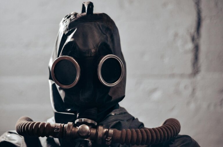 Dramatic portrait of an individual wearing a gas mask, evokes themes of protection and secrecy.
