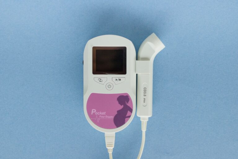 Close-up of a handheld Doppler fetal monitor used for prenatal care.