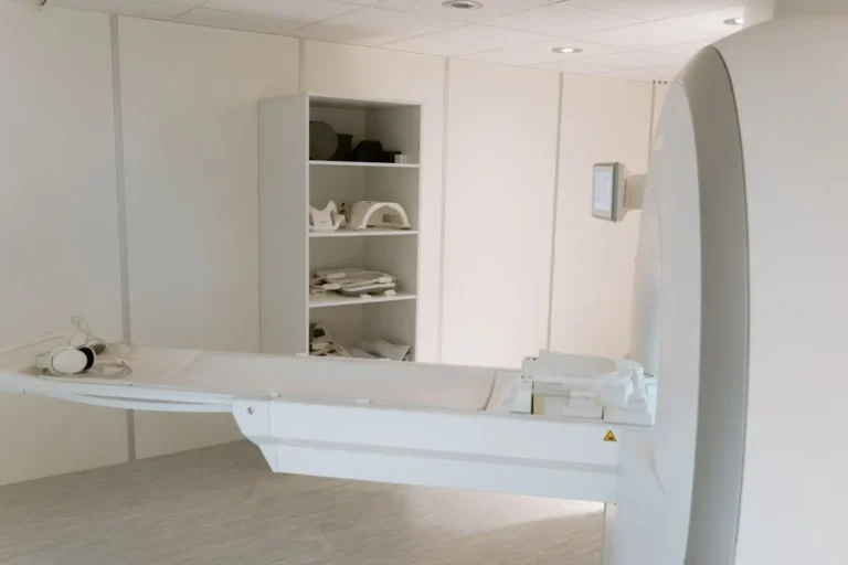 A modern CT scanning machine in a hospital imaging room, ready for patient examination.